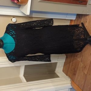 Black lace dress with black slip lining. Size 4.